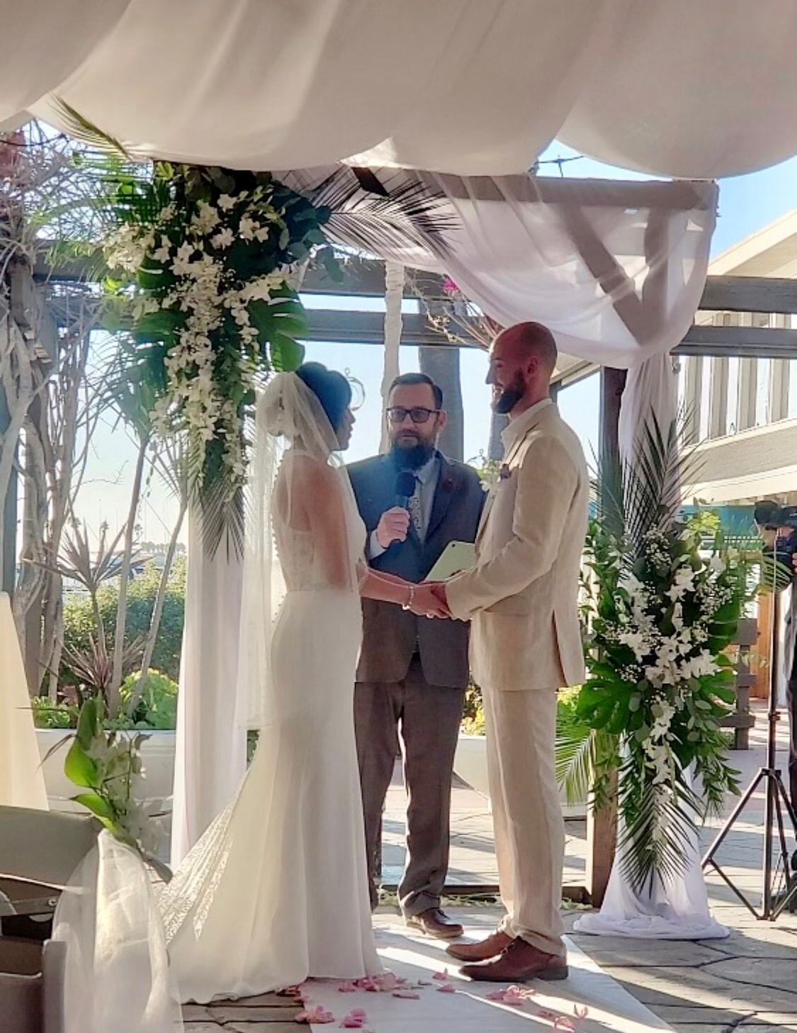 Bride and groom sharing their first kiss at the ceremony